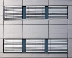 Silver Grey Jalousies exterior shutters. Windows with jalousies